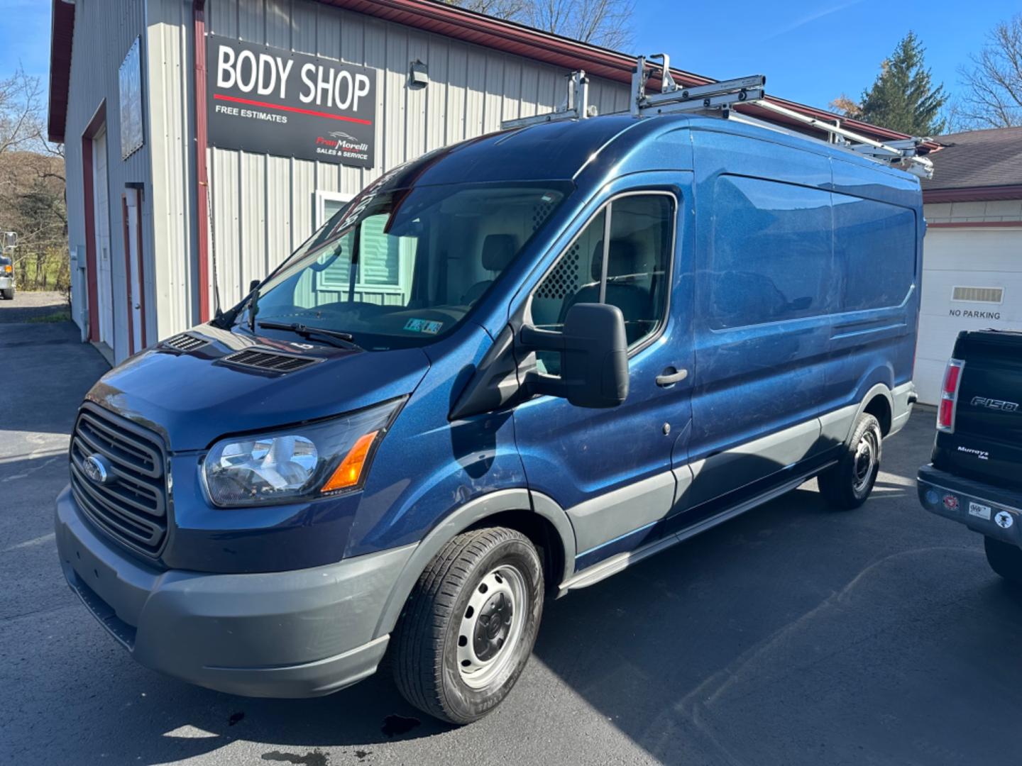 2018 Blue Ford Transit (1FTYR2CG2JK) , automatic transmission, located at 8464 Route 219, Brockway, PA, 15824, (814) 265-1330, 41.226871, -78.780518 - MUST SEE VAN...STOP AND CHECK OUT THIS 2018 FORD T250 CARGO VAN WITH BINS AND LADDER RACK. V6, AUTOMATIC, AIR CONDITION AND MORE. SERVICED AND READY TO GO. - Photo#0